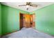 Cozy bedroom with a ceiling fan, closet, and neutral green walls, perfect for relaxation and rest at 2420 Green Rd, Loganville, GA 30052