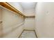 Image of a walk-in closet featuring a concrete floor and wood shelving at 2420 Green Rd, Loganville, GA 30052