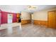 A stylish living area showcasing wood-look flooring, wood-paneled walls, and an open-concept design at 2420 Green Rd, Loganville, GA 30052