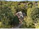 Aerial view of home surrounded by foliage at 940 Waters Reach Ct, Alpharetta, GA 30022
