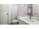 Clean bathroom featuring a modern vanity with a marble countertop and a walk-in shower at 940 Waters Reach Ct, Alpharetta, GA 30022