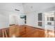 Spacious bedroom showcasing hardwood floors, elegant trim, and access to an ensuite bathroom at 940 Waters Reach Ct, Alpharetta, GA 30022