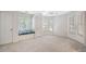 Bright bedroom with windows, a ceiling fan, and neutral carpet at 940 Waters Reach Ct, Alpharetta, GA 30022