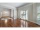 Bright living room showcasing hardwood floors, white trim and neutral walls at 940 Waters Reach Ct, Alpharetta, GA 30022