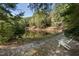 Pond with trees and chair nearby at 940 Waters Reach Ct, Alpharetta, GA 30022