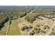 Picturesque aerial view showcasing the property's expansive lot and wooded surroundings at 1201 Keencheefoonee Rd, Rutledge, GA 30663