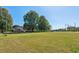 Expansive backyard with mature trees, offering ample space for outdoor activities and enjoyment at 1201 Keencheefoonee Rd, Rutledge, GA 30663
