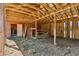 Rustic barn interior featuring wooden beams, ample space, and natural light at 1201 Keencheefoonee Rd, Rutledge, GA 30663