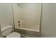 Bathroom featuring a shower-tub combo with a white toilet and shower head at 1201 Keencheefoonee Rd, Rutledge, GA 30663