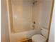 Bathroom featuring a shower-tub combo with a white toilet at 1201 Keencheefoonee Rd, Rutledge, GA 30663