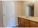 Bathroom featuring a wood vanity with sink and a mirrored wall at 1201 Keencheefoonee Rd, Rutledge, GA 30663