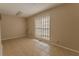 Bedroom featuring tile floors and window with blinds at 1201 Keencheefoonee Rd, Rutledge, GA 30663