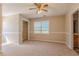 Large bedroom featuring neutral walls, a closet, and a ceiling fan at 1201 Keencheefoonee Rd, Rutledge, GA 30663
