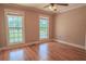 Bedroom featuring hardwood flooring, two windows, and neutral walls at 1201 Keencheefoonee Rd, Rutledge, GA 30663