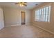 Bedroom featuring neutral carpet, ceiling fan and double-hung window at 1201 Keencheefoonee Rd, Rutledge, GA 30663