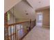 Hallway featuring a wrought iron banister with views of the living room below at 1201 Keencheefoonee Rd, Rutledge, GA 30663