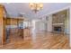 Open kitchen next to the living room featuring an island with granite countertops and stainless steel appliances at 1201 Keencheefoonee Rd, Rutledge, GA 30663