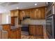Kitchen featuring wooden cabinets, stainless steel appliances, and granite countertops at 1201 Keencheefoonee Rd, Rutledge, GA 30663