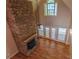 Living room showcases a stone fireplace and french doors to backyard at 1201 Keencheefoonee Rd, Rutledge, GA 30663