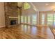 Spacious living room with soaring ceilings, stone fireplace, and lots of natural light at 1201 Keencheefoonee Rd, Rutledge, GA 30663
