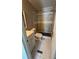 Well-lit bathroom featuring a stylish vanity, white tiled floor, and a tiled shower at 698 Rocky Plains Rd, Covington, GA 30016
