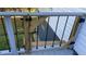 Exterior view of the backyard deck featuring railings and wood materials at 698 Rocky Plains Rd, Covington, GA 30016