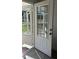 Bright, paneled front door and screen door of a home, offering light and ventilation at 698 Rocky Plains Rd, Covington, GA 30016