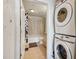 Hallway view of the bathroom, including the washer, dryer, shower and toilet at 860 Peachtree Ne St # 1903, Atlanta, GA 30308