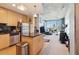Modern kitchen and living room with stainless steel appliances and an open layout at 860 Peachtree Ne St # 1903, Atlanta, GA 30308