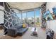 Stylish living room with modern decor, city views, and a comfortable seating area at 860 Peachtree Ne St # 1903, Atlanta, GA 30308