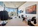 Bright living room featuring city views, modern decor, and unique wall art at 860 Peachtree Ne St # 1903, Atlanta, GA 30308