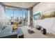 Cozy living room with a comfortable sofa, city skyline views, and contemporary design elements at 860 Peachtree Ne St # 1903, Atlanta, GA 30308
