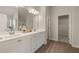 Double vanity bathroom with a large mirror and an adjacent closet at 495 Hancock Se Dr, Atlanta, GA 30354