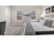 A beautifully staged primary bedroom featuring 2 windows and a neutral color palette at 495 Hancock Se Dr, Atlanta, GA 30354