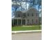 Charming two-story brick home featuring a covered front porch and manicured lawn at 495 Hancock Se Dr, Atlanta, GA 30354