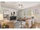 Bright and open living room with neutral color palette, stylish furnishings, and ample natural light from large windows at 495 Hancock Se Dr, Atlanta, GA 30354