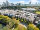 An aerial view of the complex, surrounded by lush greenery and the city skyline at 400 17Th Nw St # 2120, Atlanta, GA 30363