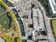 Overhead view of the community with parking, a pool and a lake at 400 17Th Nw St # 2120, Atlanta, GA 30363