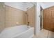 Bright bathroom featuring white tile and tub with a neutral color scheme at 400 17Th Nw St # 2120, Atlanta, GA 30363