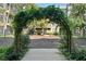 Beautiful garden courtyard framed by a vine-covered archway; perfect for relaxation and enjoying the surrounding apartment views at 400 17Th Nw St # 2120, Atlanta, GA 30363