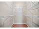 Spacious walk-in closet equipped with multiple levels of durable, white wire shelving for optimal storage and organization at 400 17Th Nw St # 2120, Atlanta, GA 30363