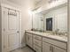 Bathroom features double sinks with granite countertops and modern fixtures at 255 Old Town Rd, Dacula, GA 30019