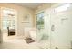 Serene bathroom featuring a soaking tub, glass shower, and a view into the bedroom at 255 Old Town Rd, Dacula, GA 30019