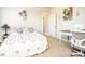 Comfortable bedroom with natural light, a quaint desk, and a floral motif at 255 Old Town Rd, Dacula, GA 30019
