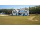 Charming two-story home with a manicured lawn, showcasing the well-maintained exterior and inviting curb appeal at 255 Old Town Rd, Dacula, GA 30019