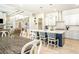 Open kitchen features white cabinets, stainless steel appliances, a large island, and an adjacent dining area at 255 Old Town Rd, Dacula, GA 30019