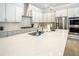 Bright kitchen featuring stainless steel appliances, large island, white cabinets, and ample counter space at 255 Old Town Rd, Dacula, GA 30019