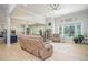 Bright living room featuring hardwood floors, neutral walls, and an open layout with a kitchen view at 255 Old Town Rd, Dacula, GA 30019