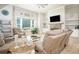 Bright living room featuring hardwood floors, neutral walls, a fireplace, and a view of the TV at 255 Old Town Rd, Dacula, GA 30019