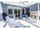 Inviting outdoor living space featuring a fireplace, comfortable seating, and a patio at 255 Old Town Rd, Dacula, GA 30019